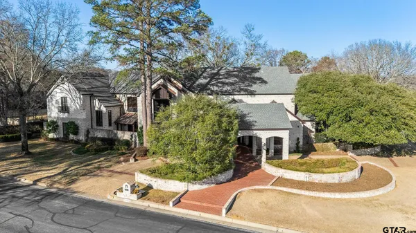 a house with trees in the background