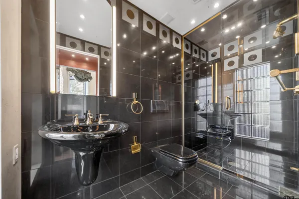 a bathroom with a sink and mirror