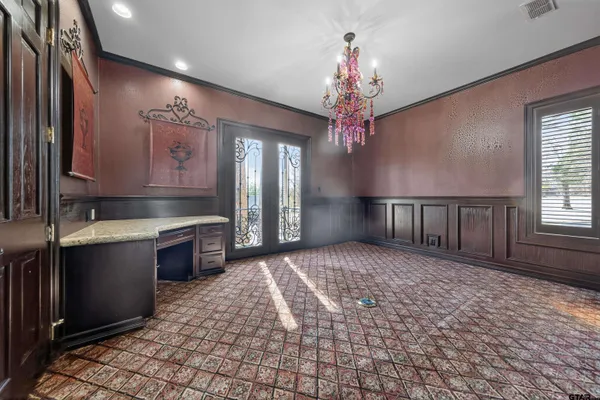 a large kitchen with kitchen island granite countertop a sink window and refrigerator
