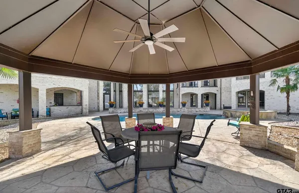 a dining room with furniture and chandelier
