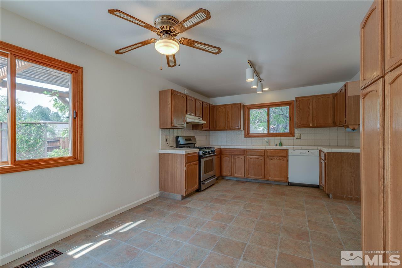 200 Gooseberry Drive Reno, NV 89523 - Photo 11 of 25 a large kitchen with a large window stainless steel appliances and cabinets