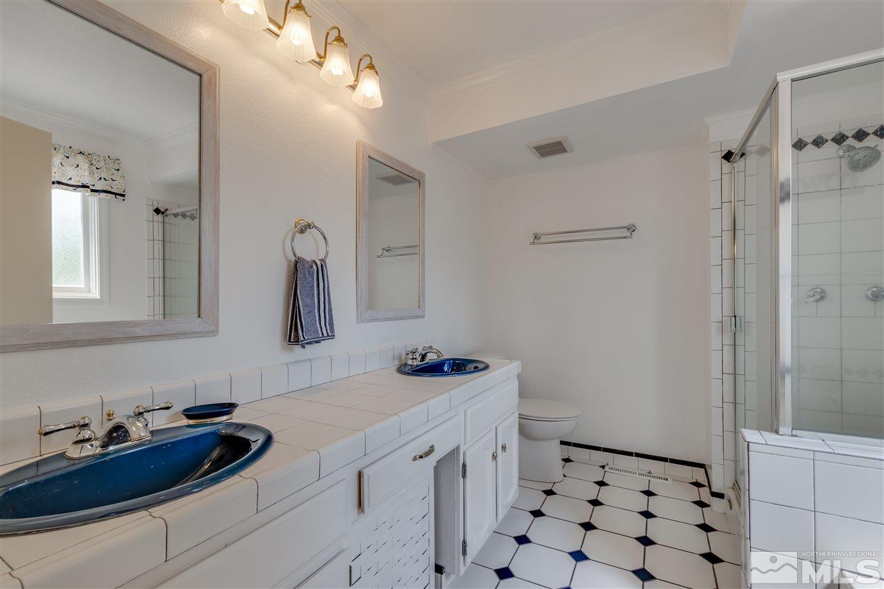 200 Gooseberry Drive Reno, NV 89523 - Photo 15 of 25 a bathroom with a sink vanity granite and a mirror