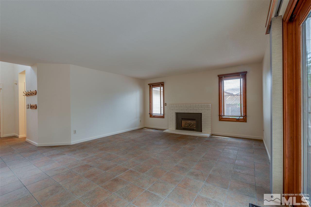 200 Gooseberry Drive Reno, NV 89523 - Photo 20 of 25 an empty room with windows and fireplace