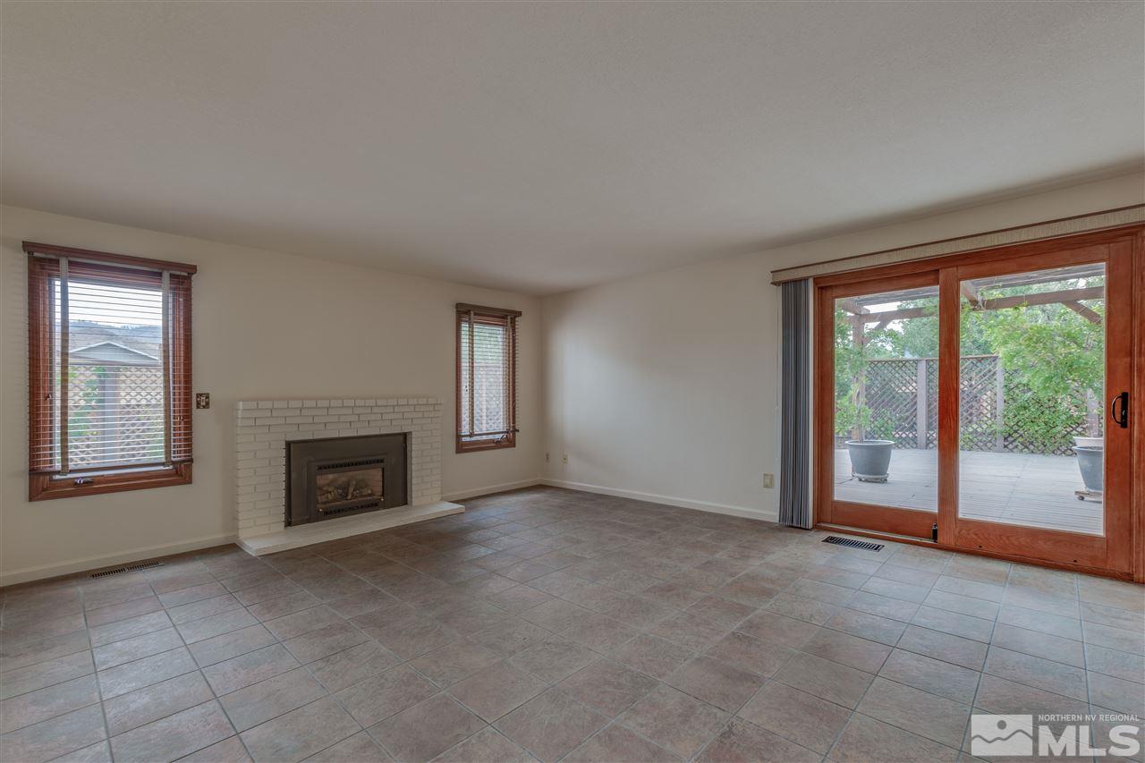 200 Gooseberry Drive Reno, NV 89523 - Photo 21 of 25 an empty room with fireplace and large window