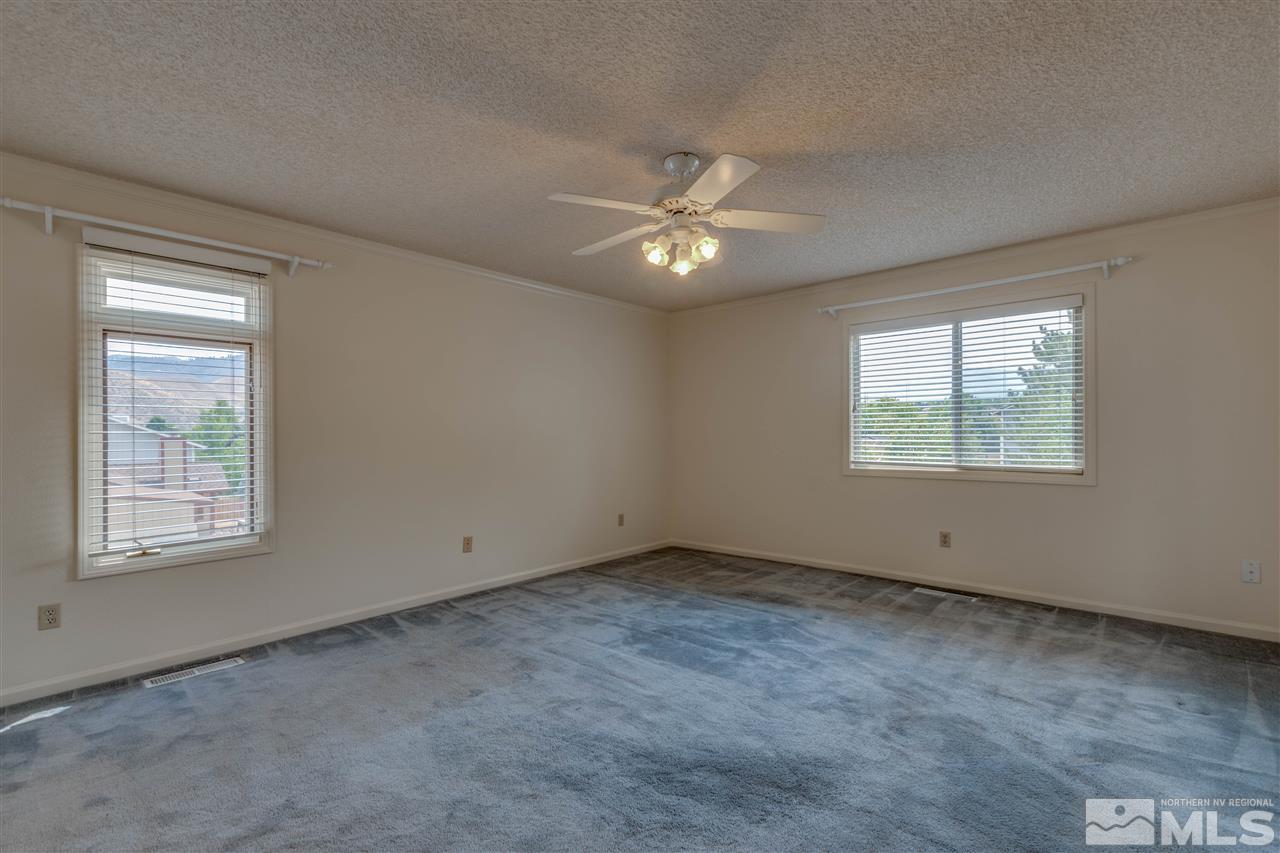 200 Gooseberry Drive Reno, NV 89523 - Photo 23 of 25 an empty room with a window and a fan