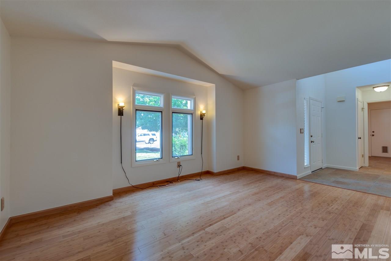 200 Gooseberry Drive Reno, NV 89523 - Photo 7 of 25 an empty room with wooden floor and windows