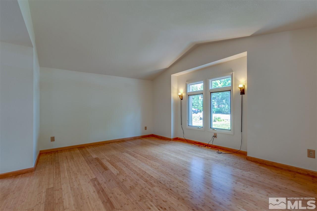 200 Gooseberry Drive Reno, NV 89523 - Photo 8 of 25 an empty room with wooden floor and windows