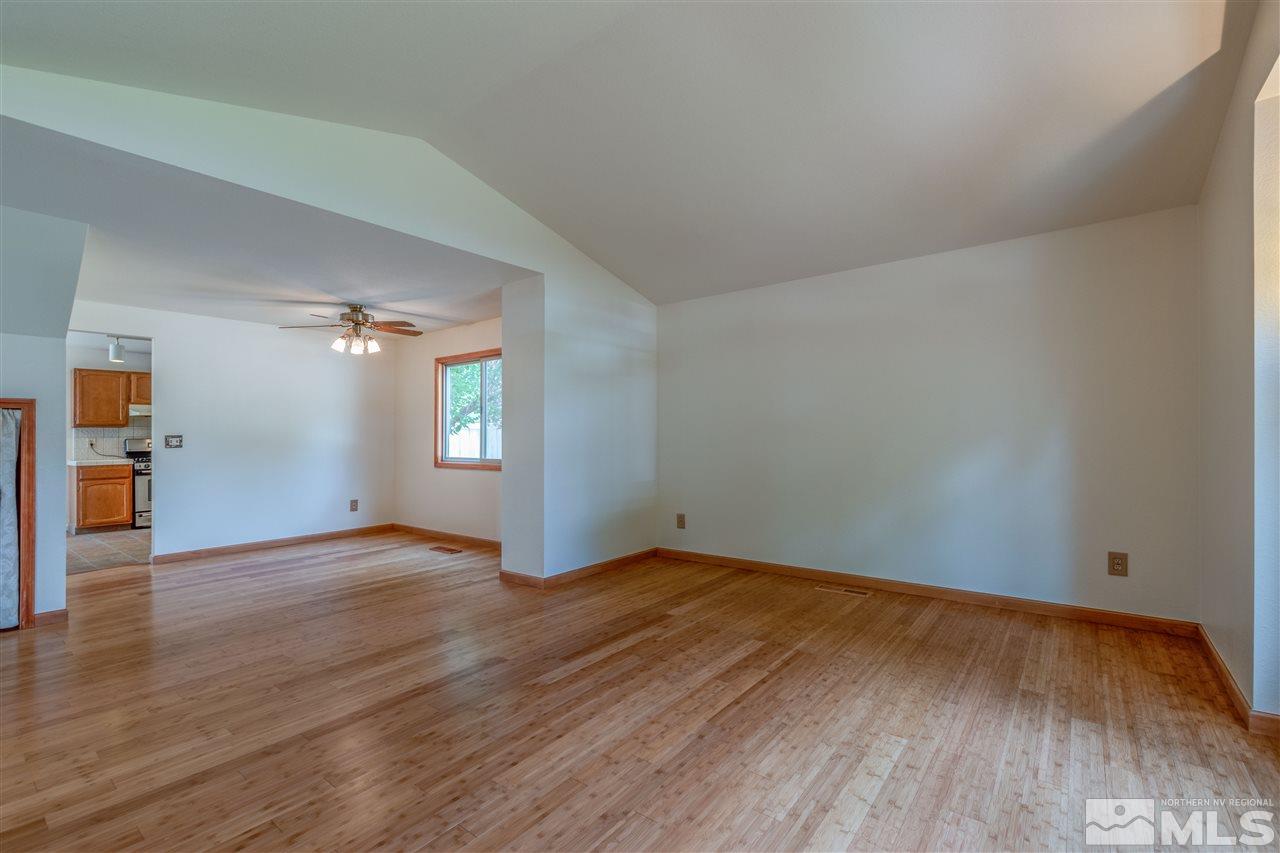 200 Gooseberry Drive Reno, NV 89523 - Photo 9 of 25 an empty room with wooden floor and windows