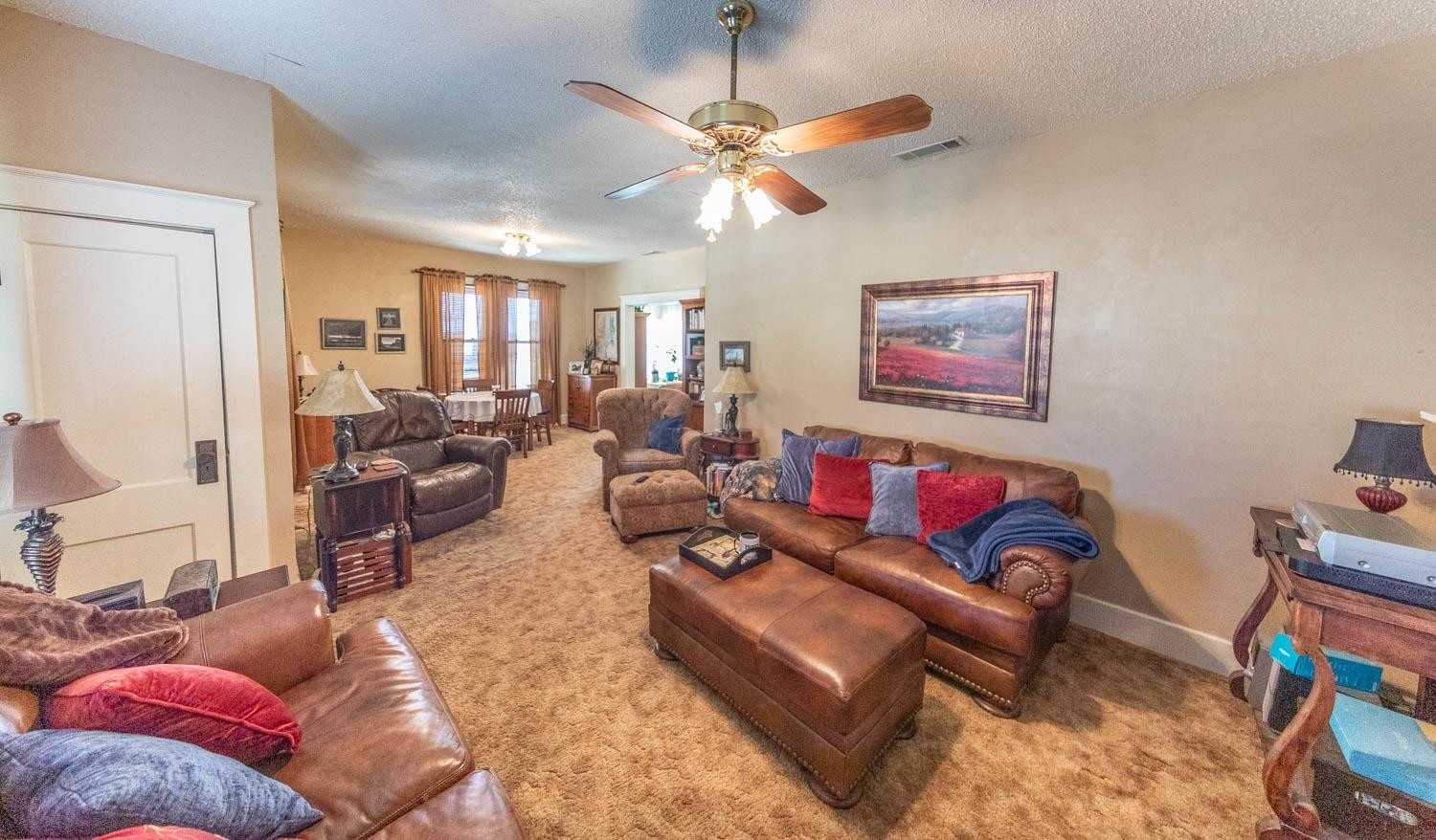 632 FM 3269 Muleshoe, TX 79347 - Photo 11 of 48 a living room with furniture and a ceiling fan