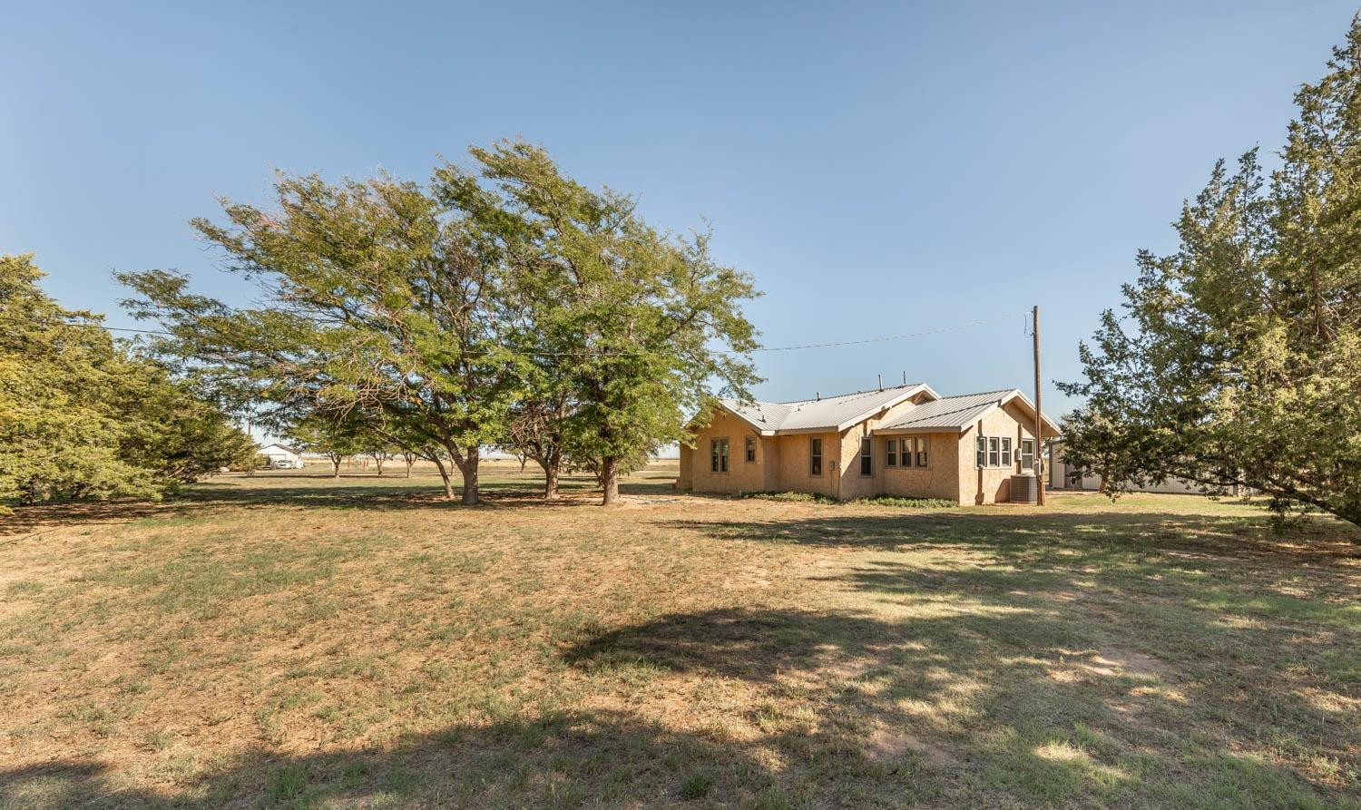632 FM 3269 Muleshoe, TX 79347 - Photo 25 of 48 a view of a yard with a house