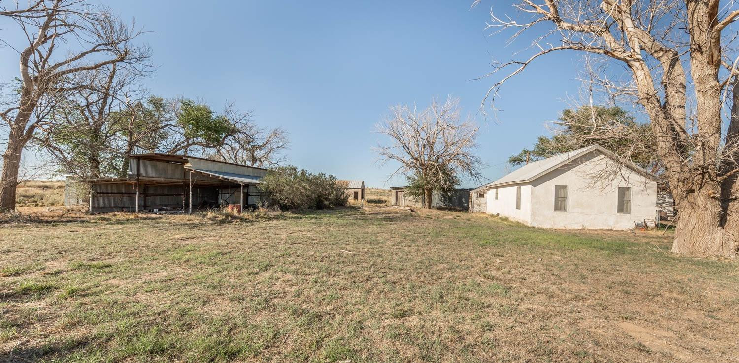 632 FM 3269 Muleshoe, TX 79347 - Photo 43 of 48 a front view of a house with a yard and garage