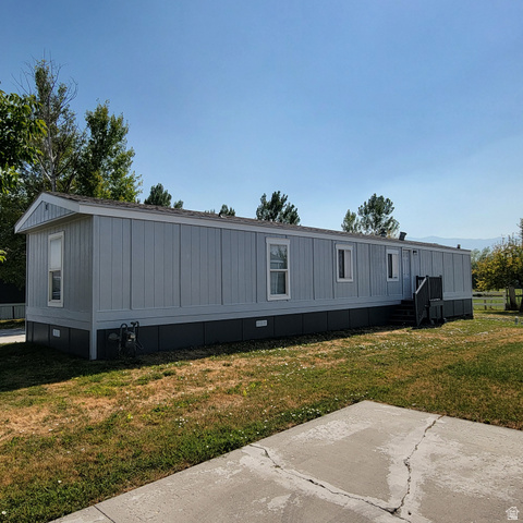 1735 South 1380 West Logan, UT 84321 - Photo 46 of 46 Light blue siding exterior with white trim and dark foundation