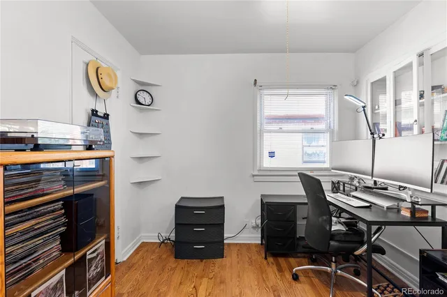 a bathroom with a sink a toilet a mirror and shower curtain