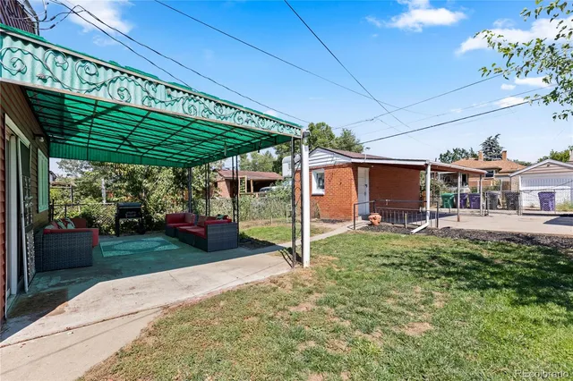 a view of a patio with table and chairs potted plants with wooden floor