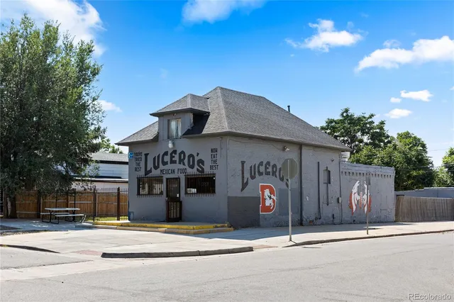 a view of a grassy field with island in the background
