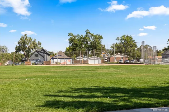 a view of a park with large trees
