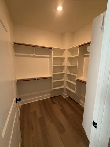 a view of an empty walk in closet