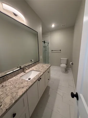 a bathroom with a sink and a toilet