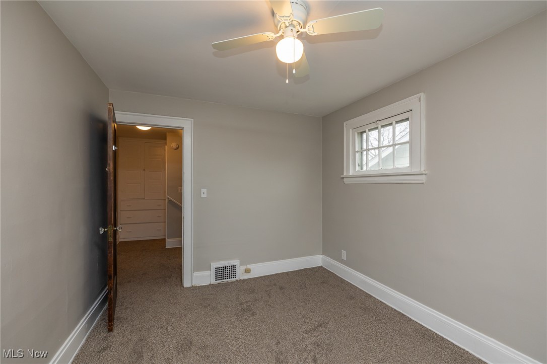 3396 Tullamore Road Cleveland, OH 44118 - Photo 20 of 23 Empty room with light carpet and baseboards