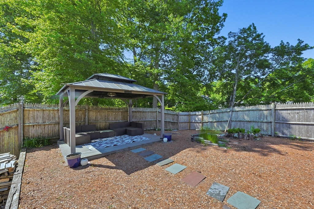 118 Spruce Road Norwood, MA 02062 - Photo 34 of 39 a backyard of a house with lots of green space