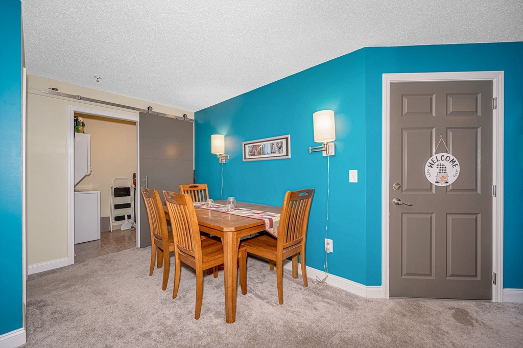 200 Market Street, Unit 3409 Lowell, MA 01852 - Photo 7 of 21 a view of a livingroom with furniture and window