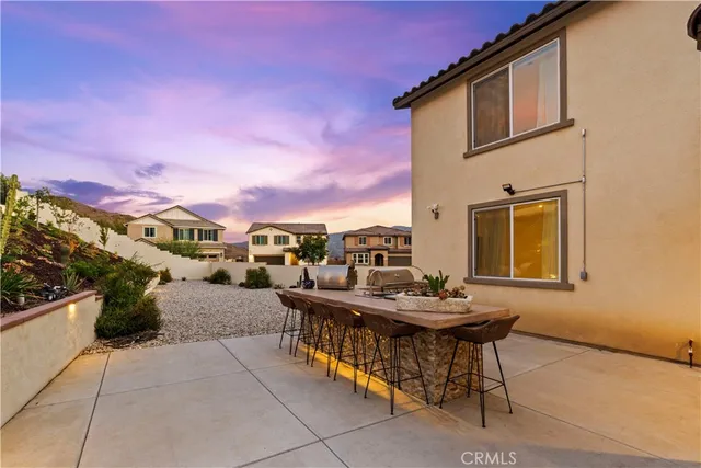 a view of a room with wooden floor and a sink