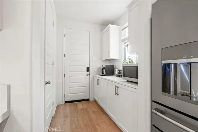 a bedroom with a bed and a night stand