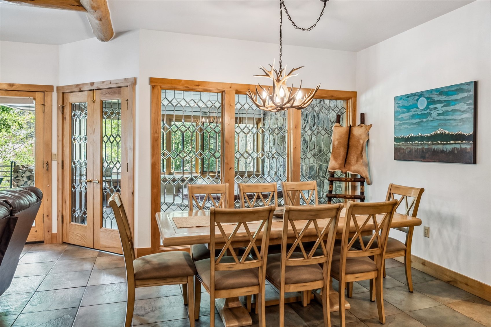 1201 West Keystone Road, Unit 2724 Keystone, CO 80435 - Photo 5 of 28 Dining area with an inviting chandelier, french doors, and tile floors