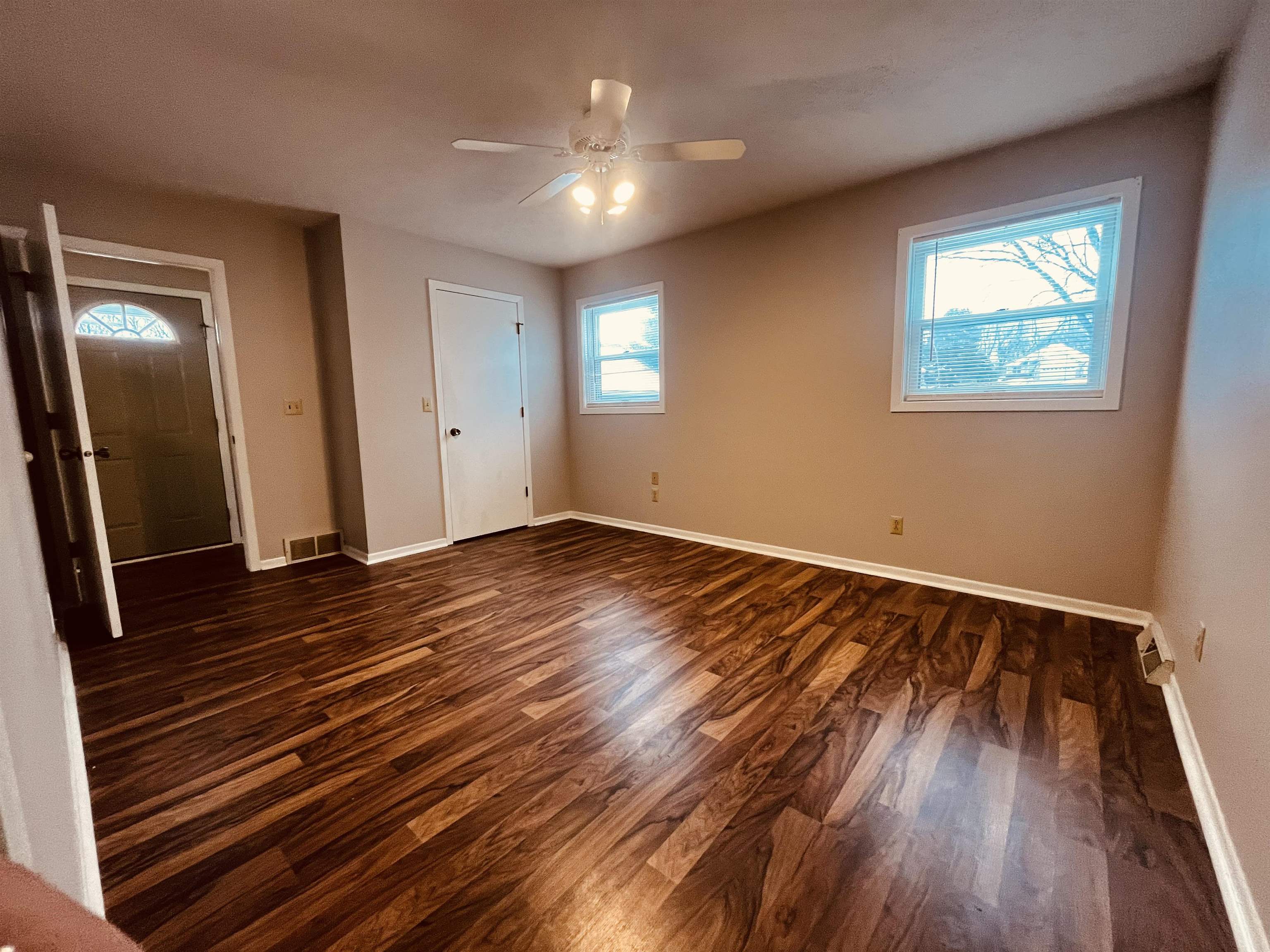 960 Breckenboro Road Lake Summerset, IL 61019 - Photo 7 of 16 a view of an empty room with wooden floor and a window