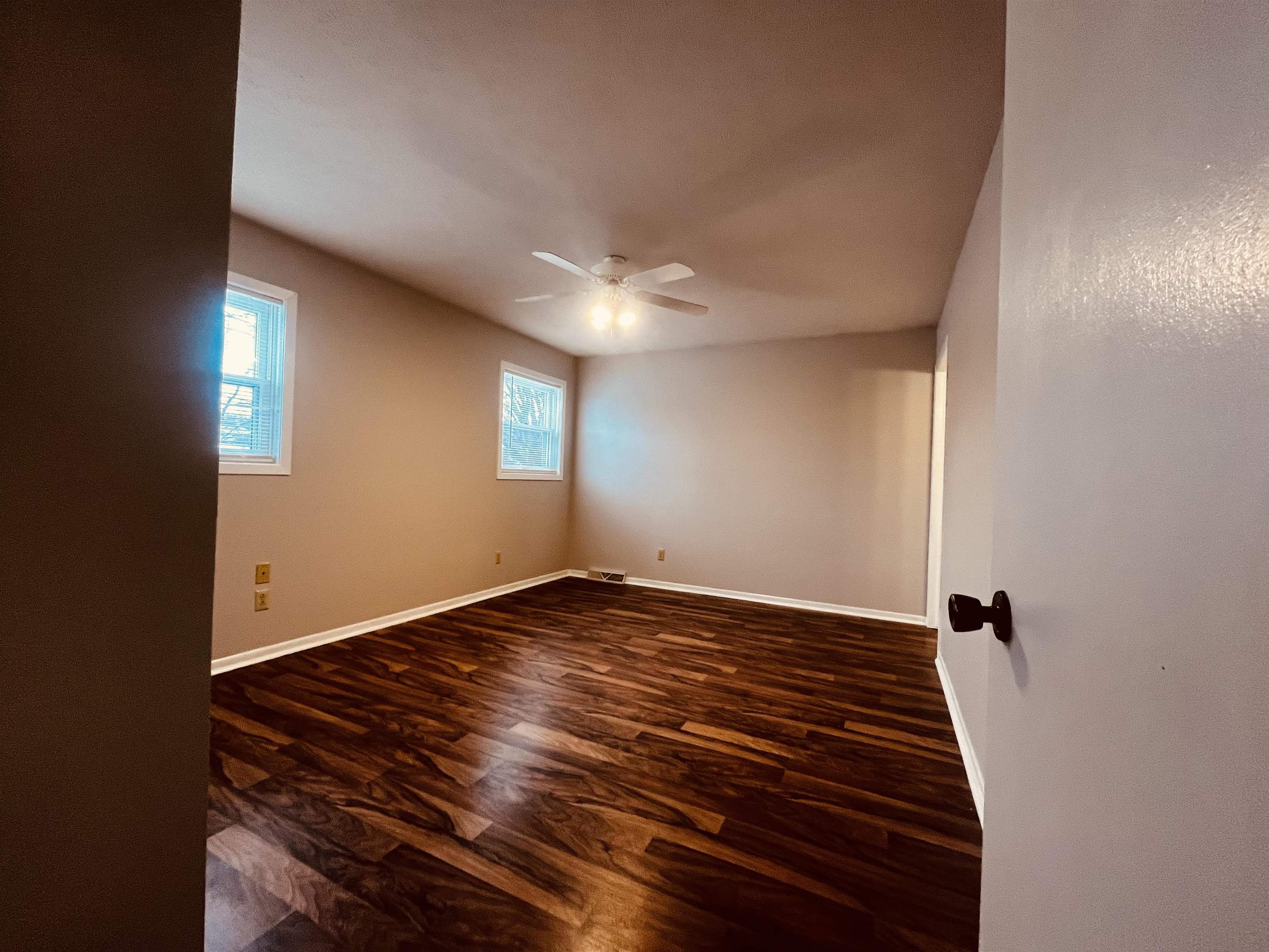 960 Breckenboro Road Lake Summerset, IL 61019 - Photo 8 of 16 a view of an empty room with window and wooden floor