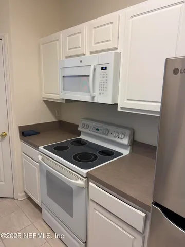 a close view of a stove top oven sitting inside of a kitchen