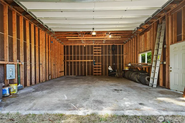 a view of an empty room with a garage
