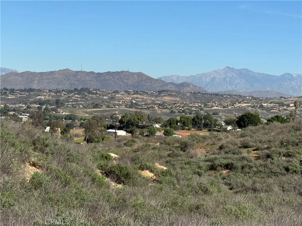 0 Apn, Unit 245080005 Riverside, CA 92501 - Photo 2 of 21 a view of a lush green field with mountains in the background