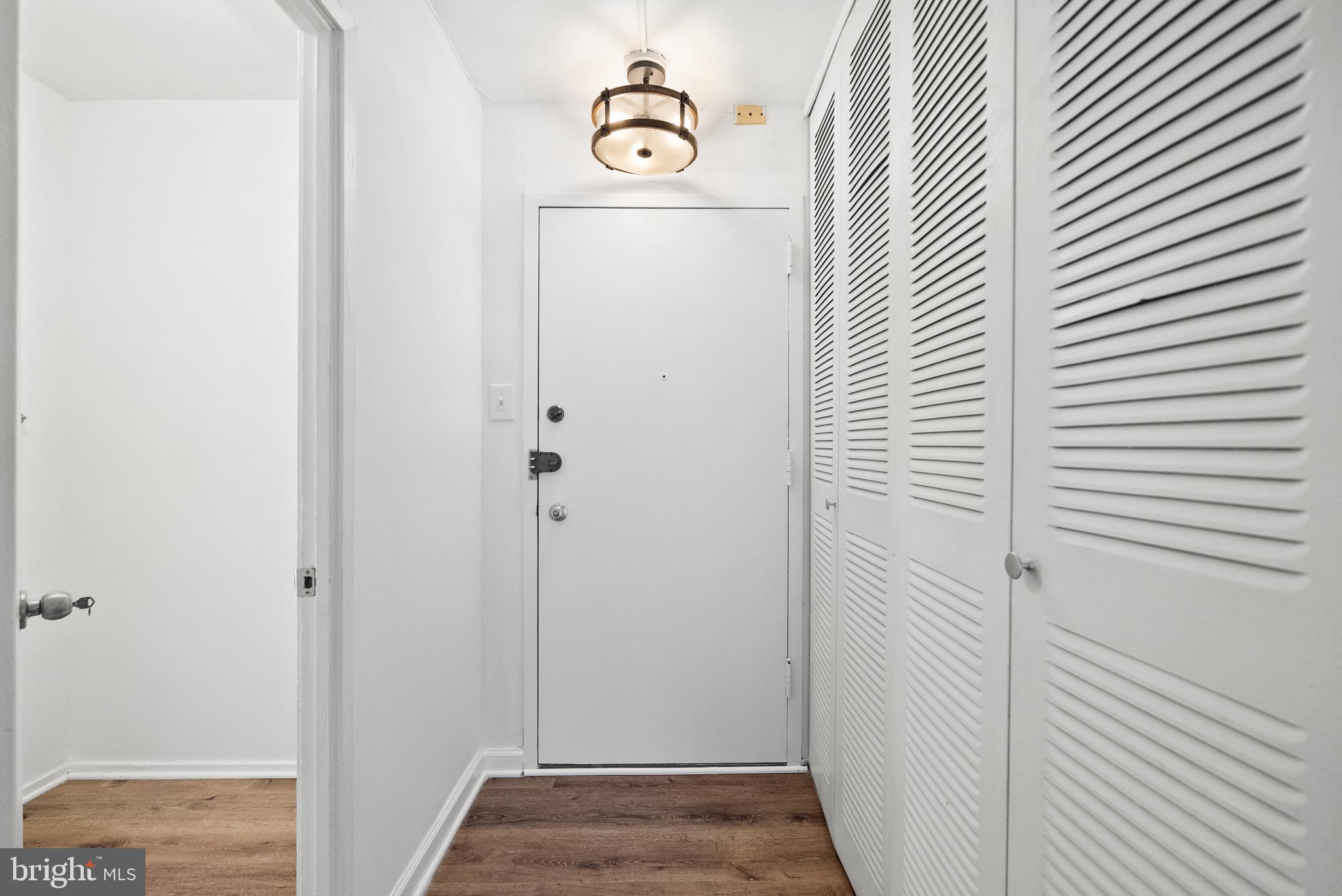 1301 Delaware Avenue Southwest, Unit N108 Washington, DC 20024 - Photo 21 of 39 a view of a hallway with wooden floor