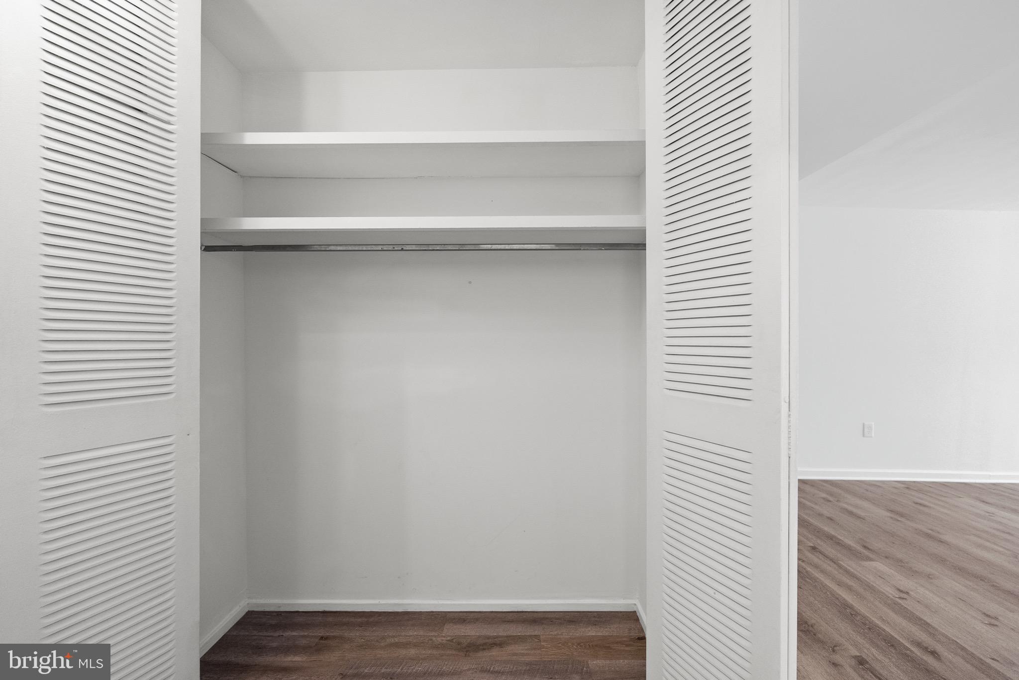 1301 Delaware Avenue Southwest, Unit N108 Washington, DC 20024 - Photo 24 of 39 a view of a hallway with wooden floor