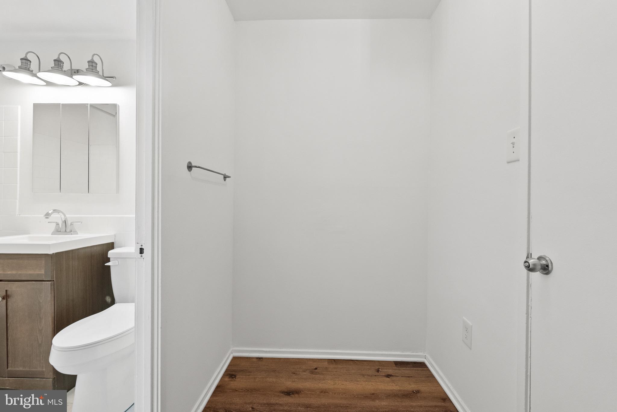 1301 Delaware Avenue Southwest, Unit N108 Washington, DC 20024 - Photo 25 of 39 a bathroom with a sink and toilet