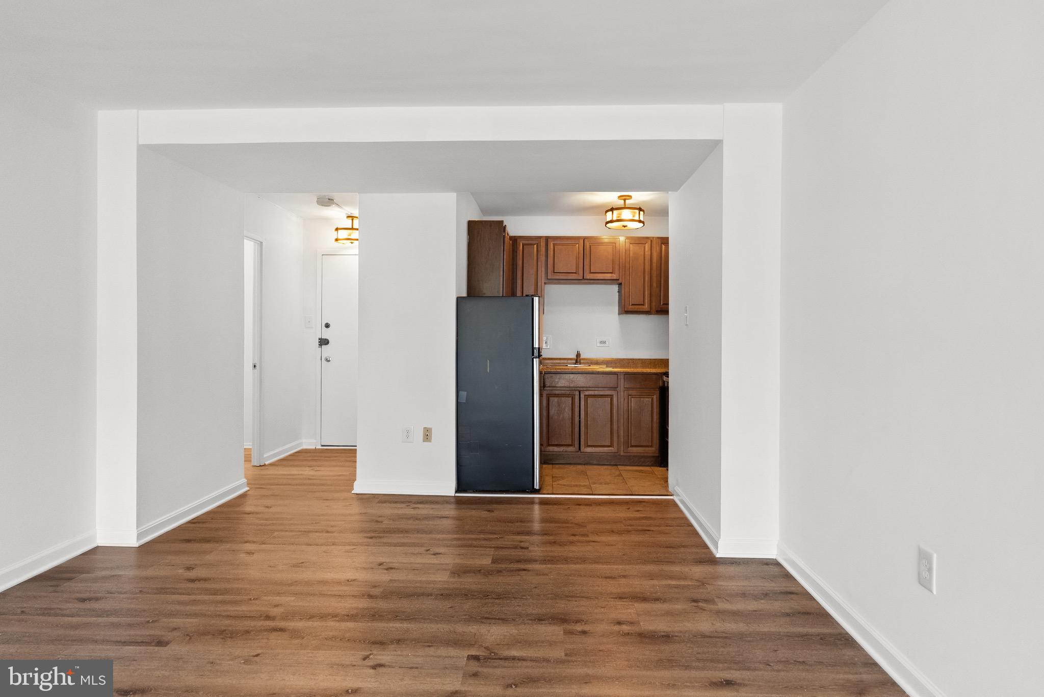 1301 Delaware Avenue Southwest, Unit N108 Washington, DC 20024 - Photo 10 of 39 a view of kitchen and wooden floor
