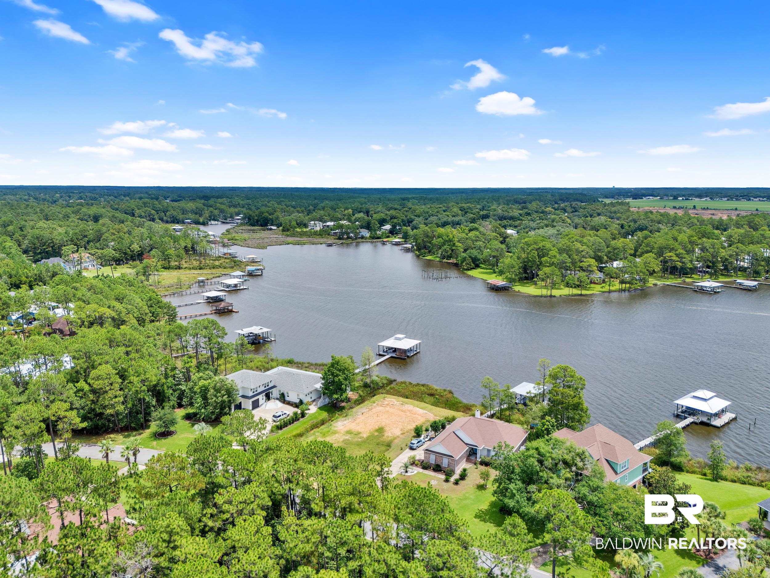 8963 Bay Point Drive Elberta, AL 36530 - Photo 12 of 25 Bird's eye view of a large body of water and a heavily wooded area