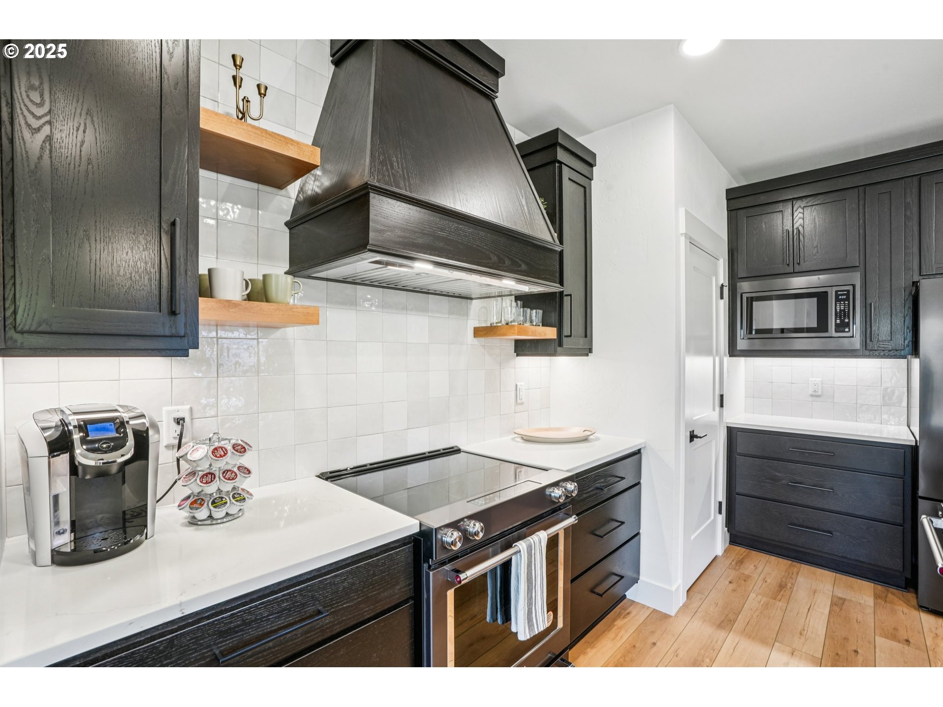 1708 Northwest 21st Way Battle Ground, WA 98604 - Photo 11 of 36 a kitchen with stainless steel appliances granite countertop a sink and a stove