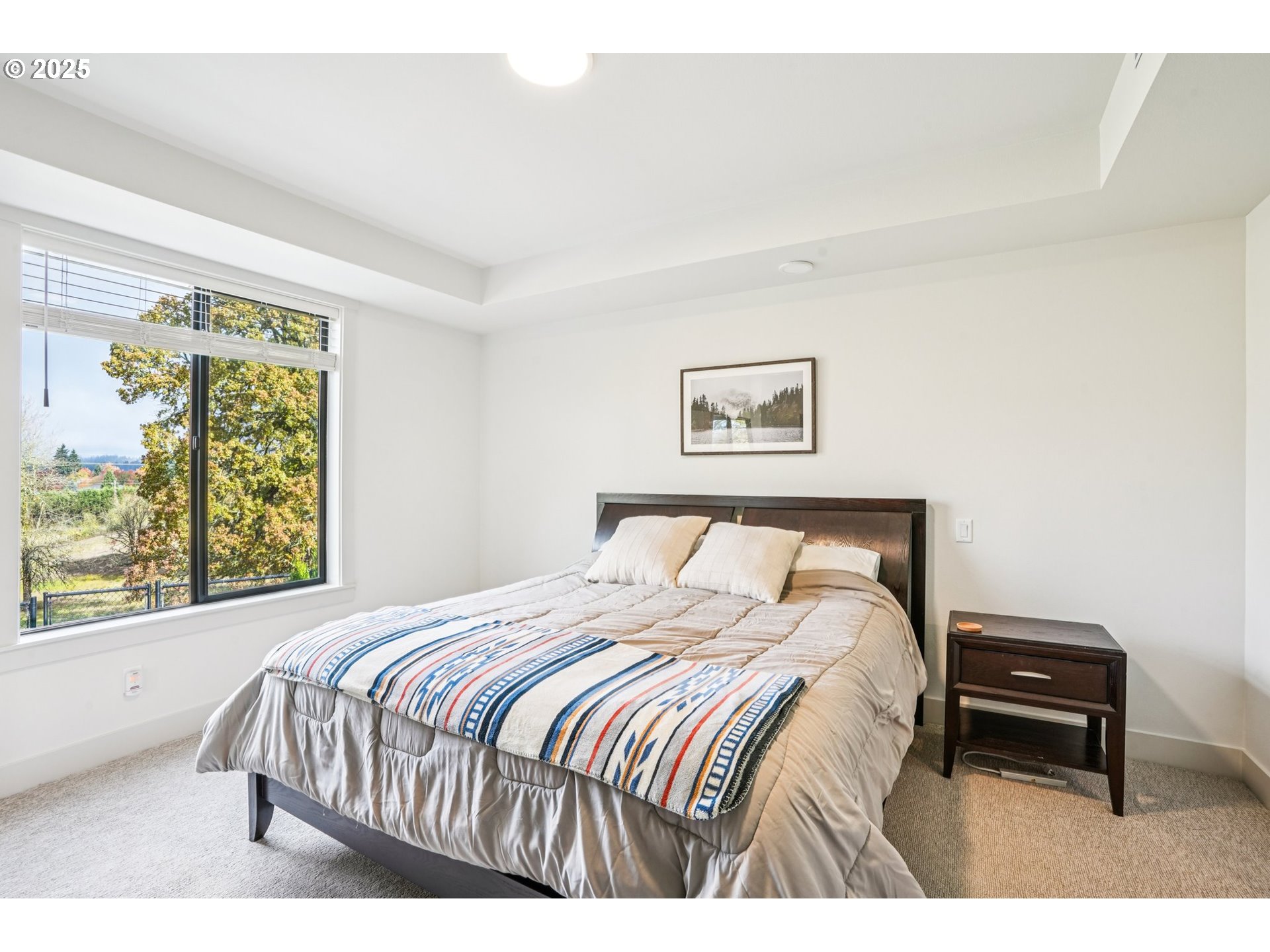 1708 Northwest 21st Way Battle Ground, WA 98604 - Photo 19 of 36 a bedroom with a bed a table and a window