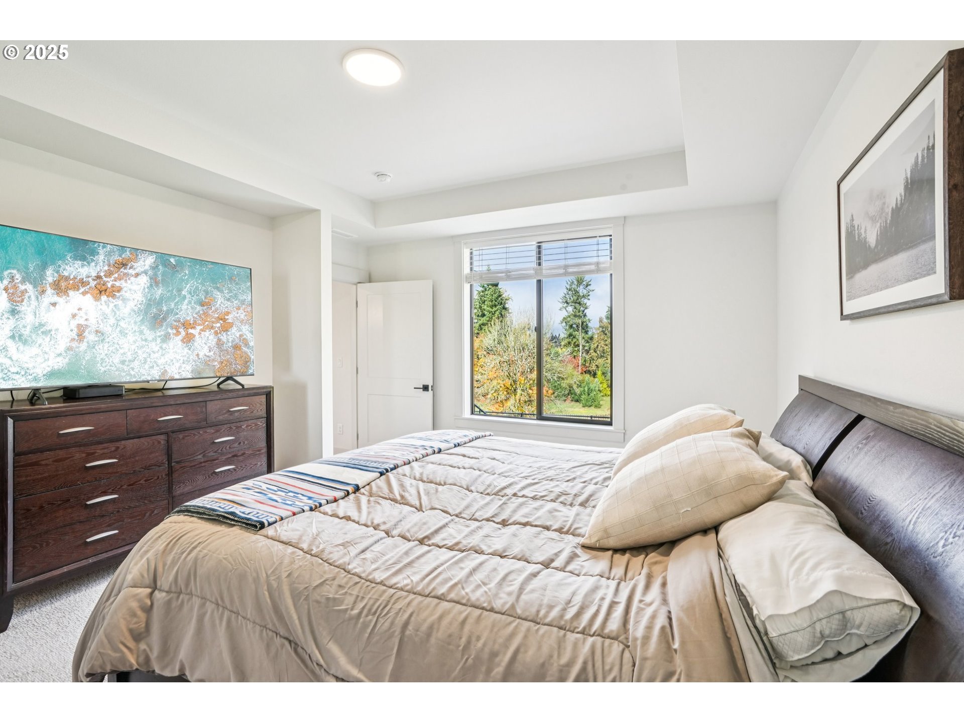 1708 Northwest 21st Way Battle Ground, WA 98604 - Photo 20 of 36 a bedroom with a bed and a flat screen tv