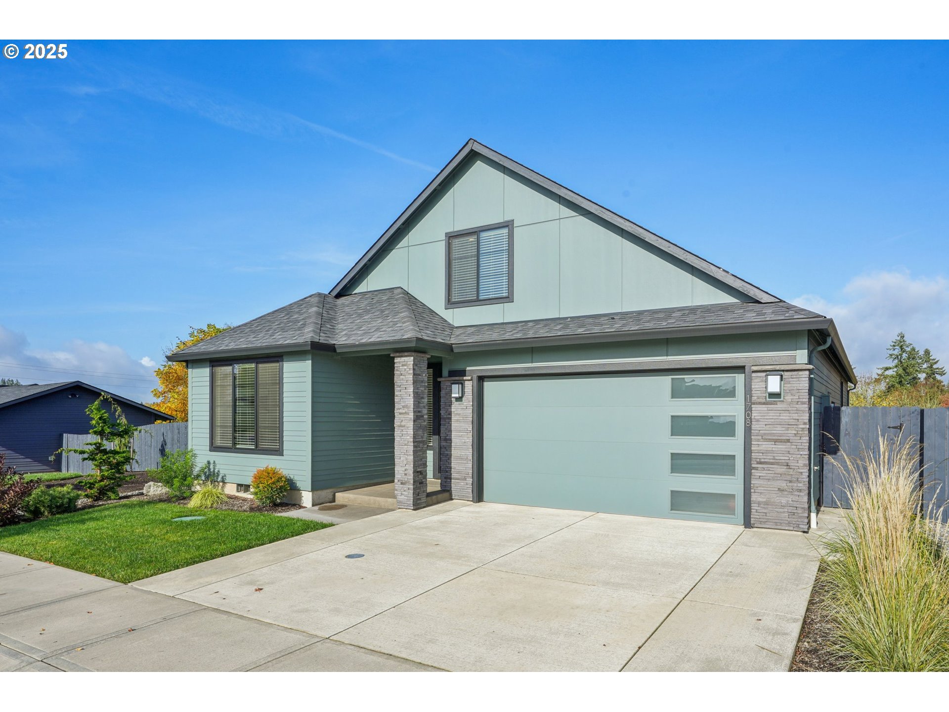 1708 Northwest 21st Way Battle Ground, WA 98604 - Photo 2 of 36 a front view of a house with a yard and garage