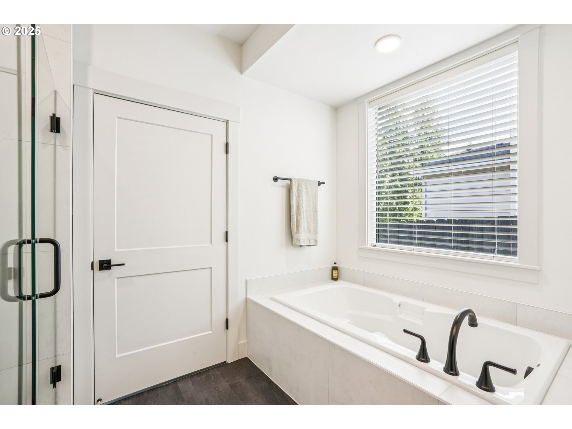 1708 Northwest 21st Way Battle Ground, WA 98604 - Photo 23 of 36 a bathroom with a tub sink and mirror