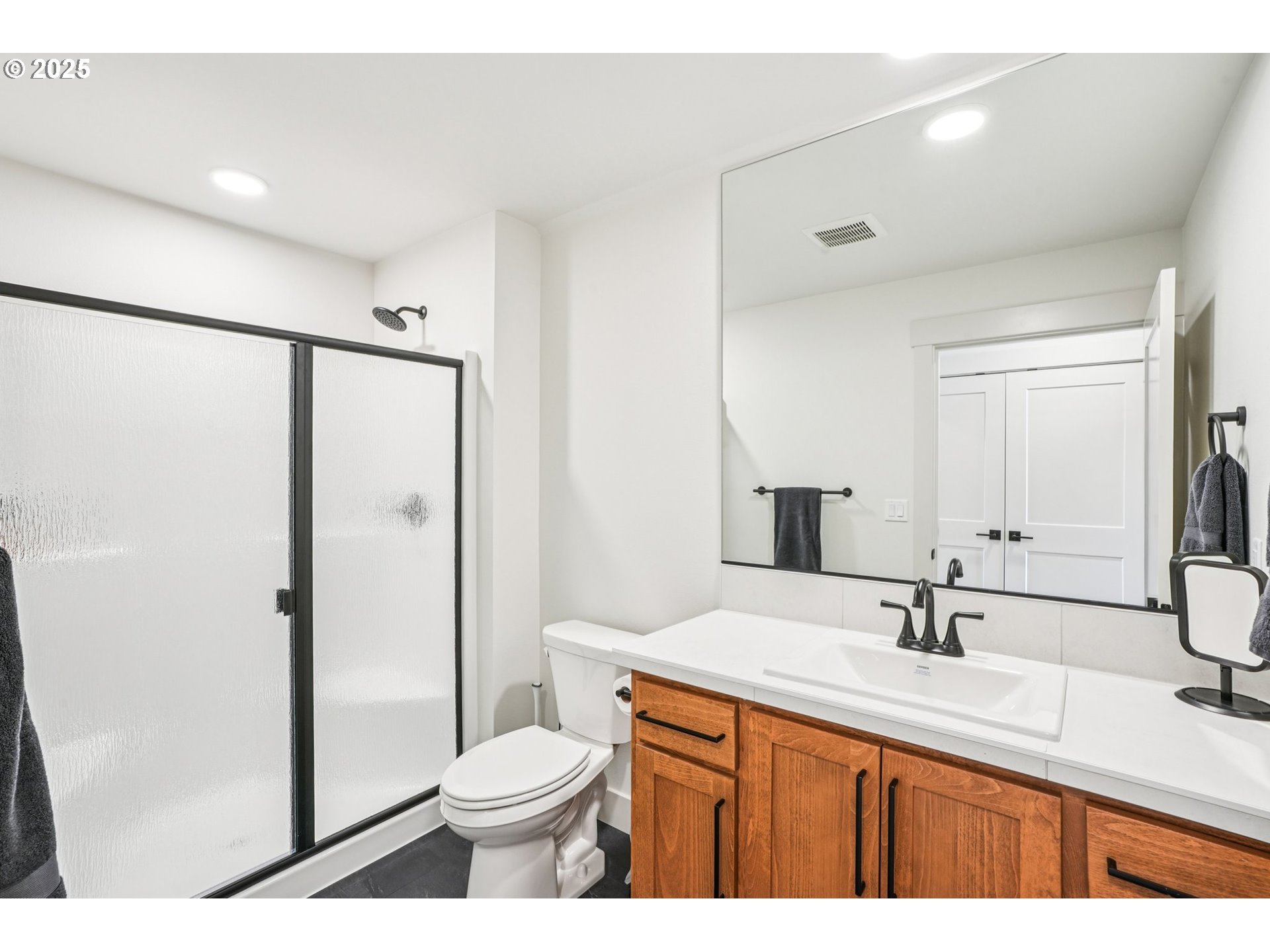 1708 Northwest 21st Way Battle Ground, WA 98604 - Photo 27 of 36 a bathroom with a granite countertop sink toilet and shower
