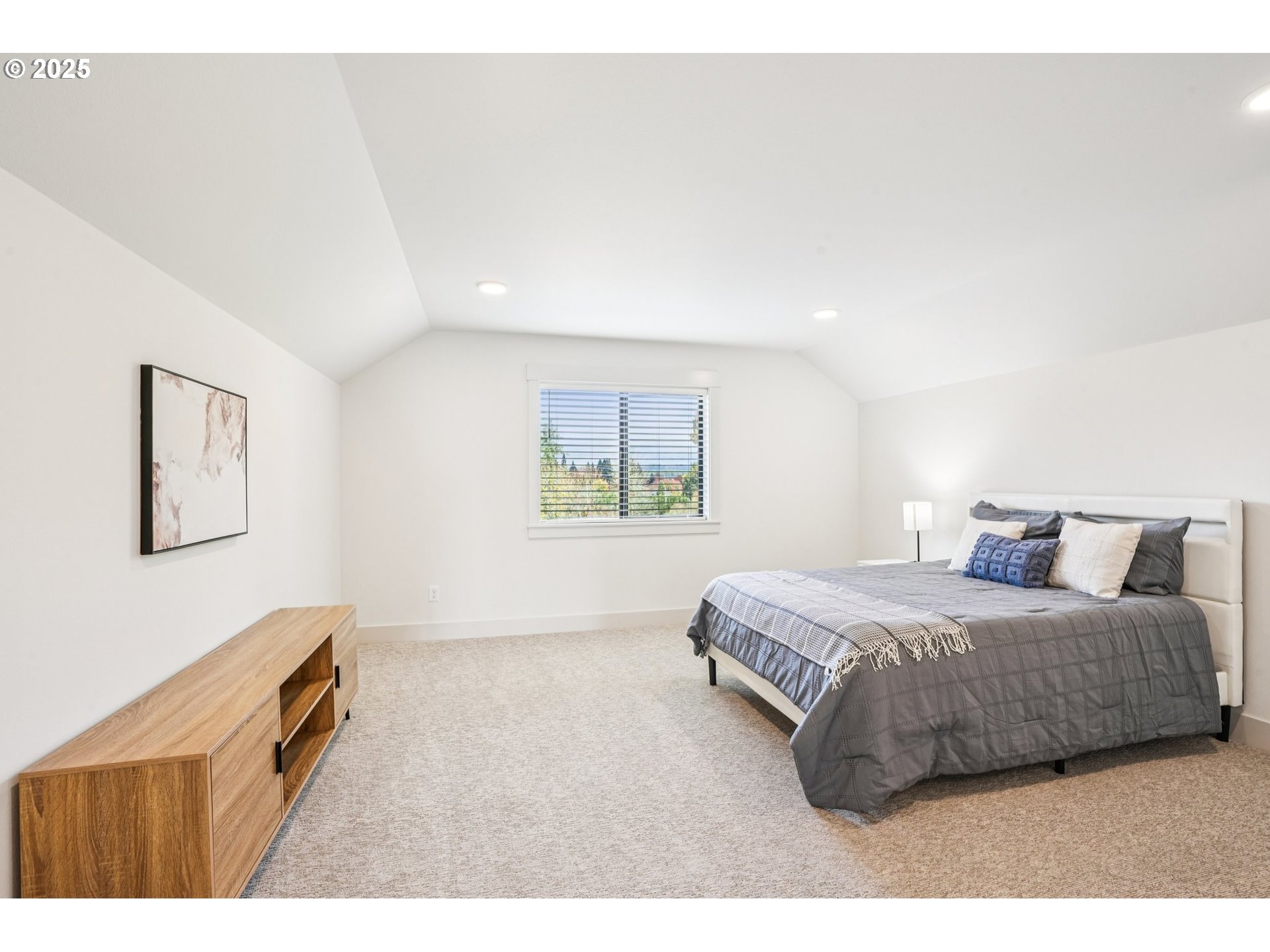 1708 Northwest 21st Way Battle Ground, WA 98604 - Photo 28 of 36 a bedroom with a bed and a painting on the wall