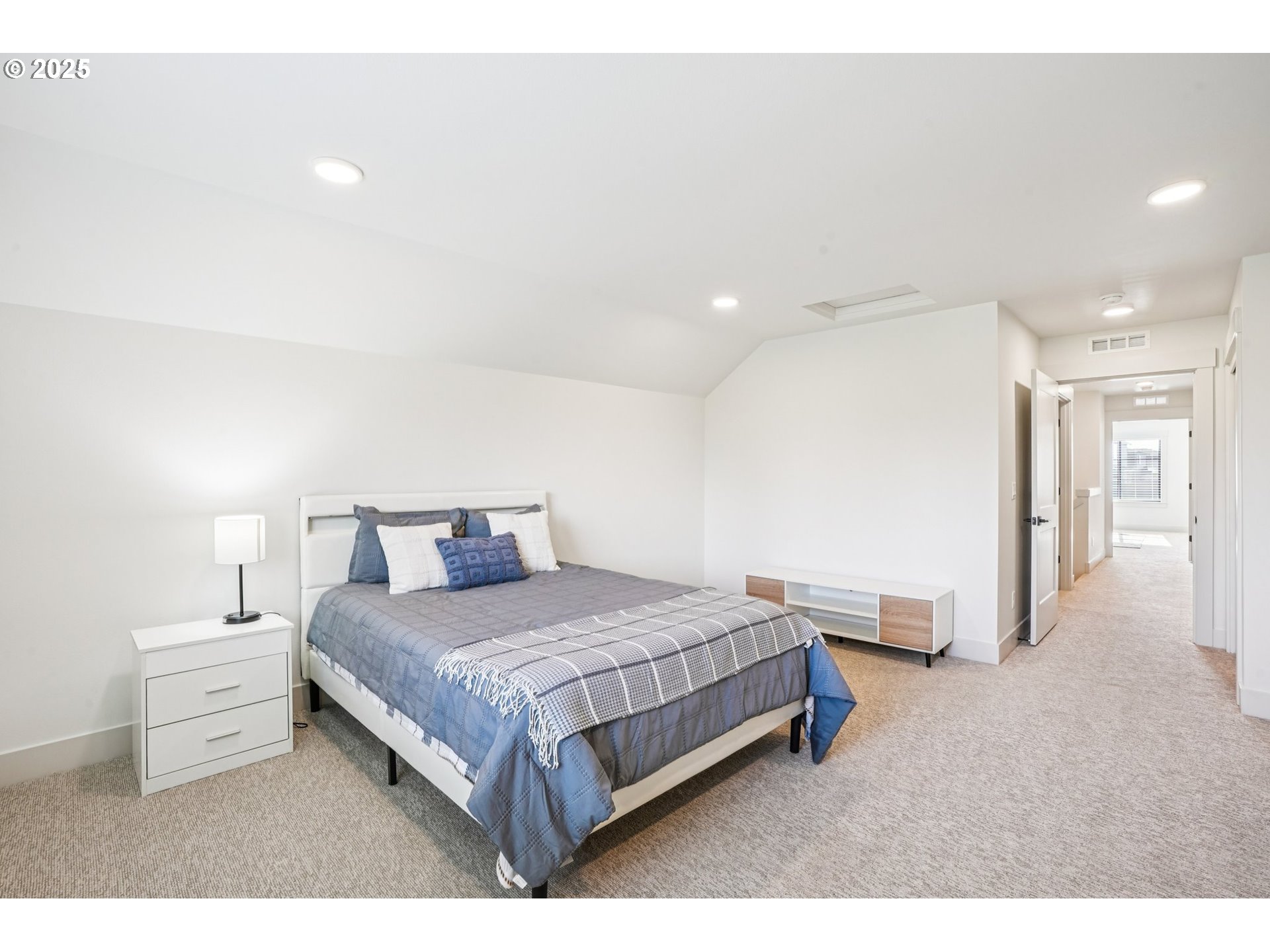 1708 Northwest 21st Way Battle Ground, WA 98604 - Photo 29 of 36 a bedroom with a bed and a lamp