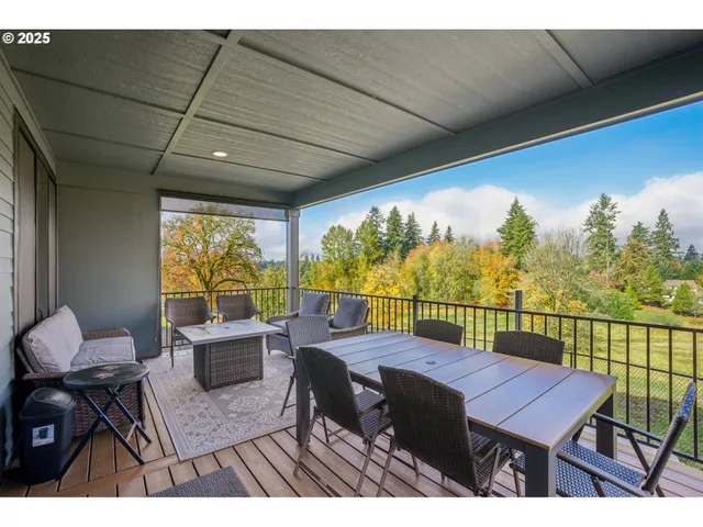 a balcony with furniture and a potted plant