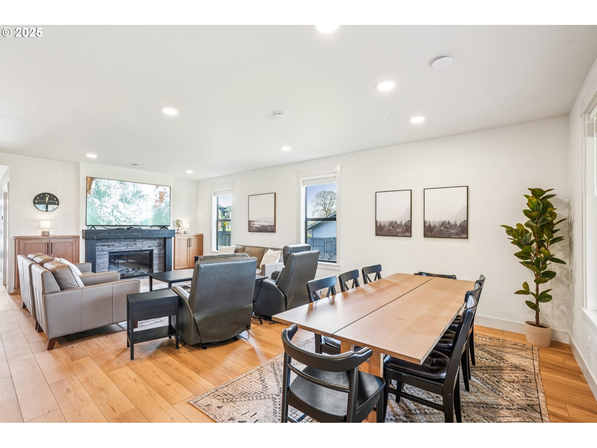 1708 Northwest 21st Way Battle Ground, WA 98604 - Photo 6 of 36 a living room with furniture a dining table and a potted plant