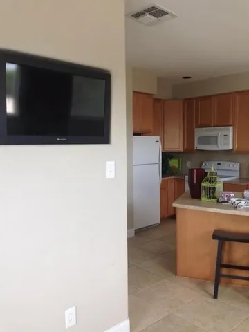 a kitchen with stainless steel appliances a refrigerator and a microwave