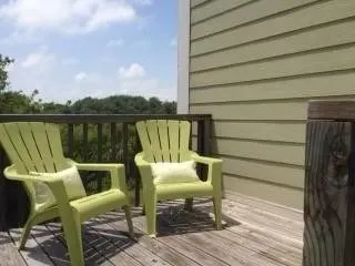 a balcony with table and chairs